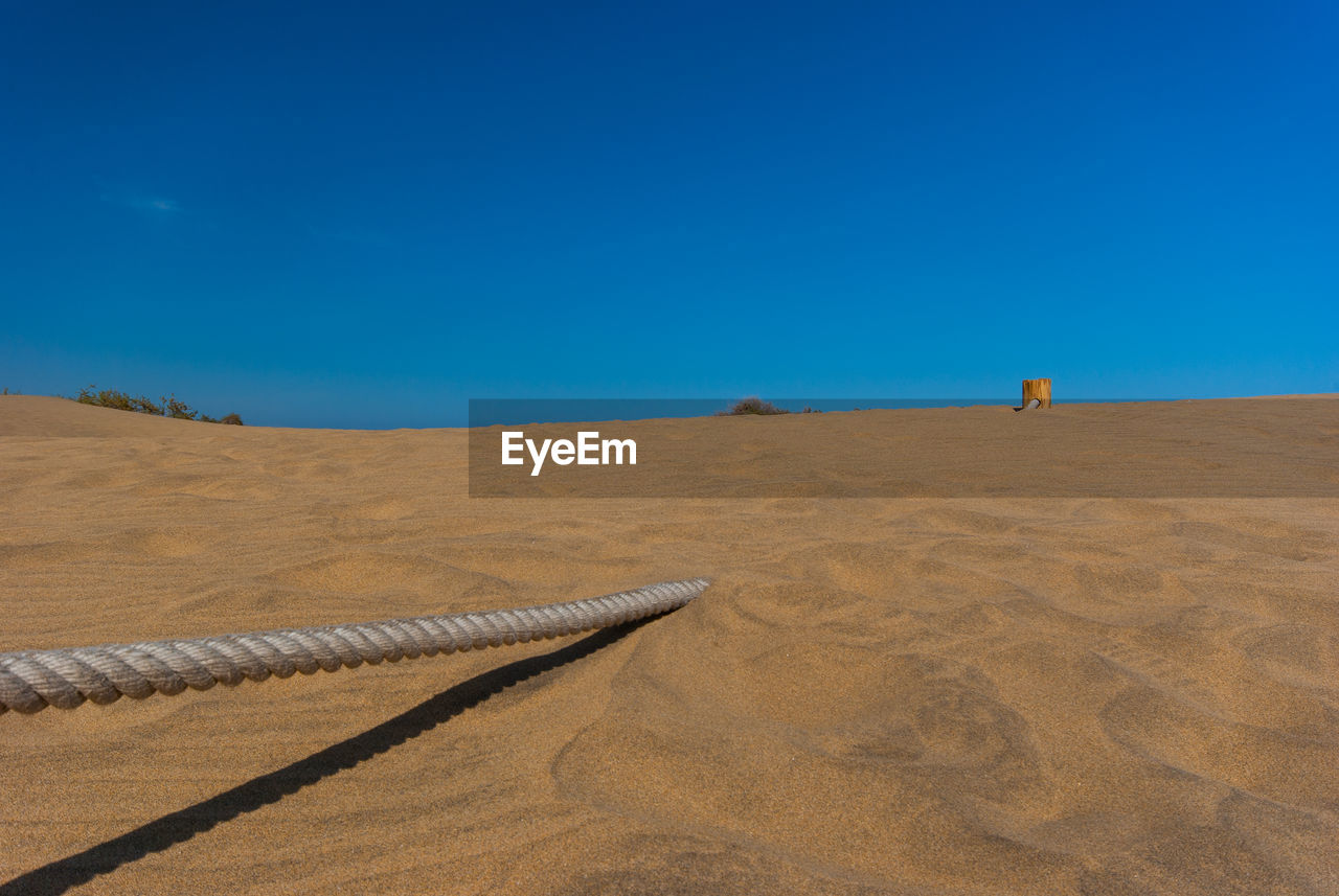 SCENIC VIEW OF DESERT AGAINST CLEAR SKY