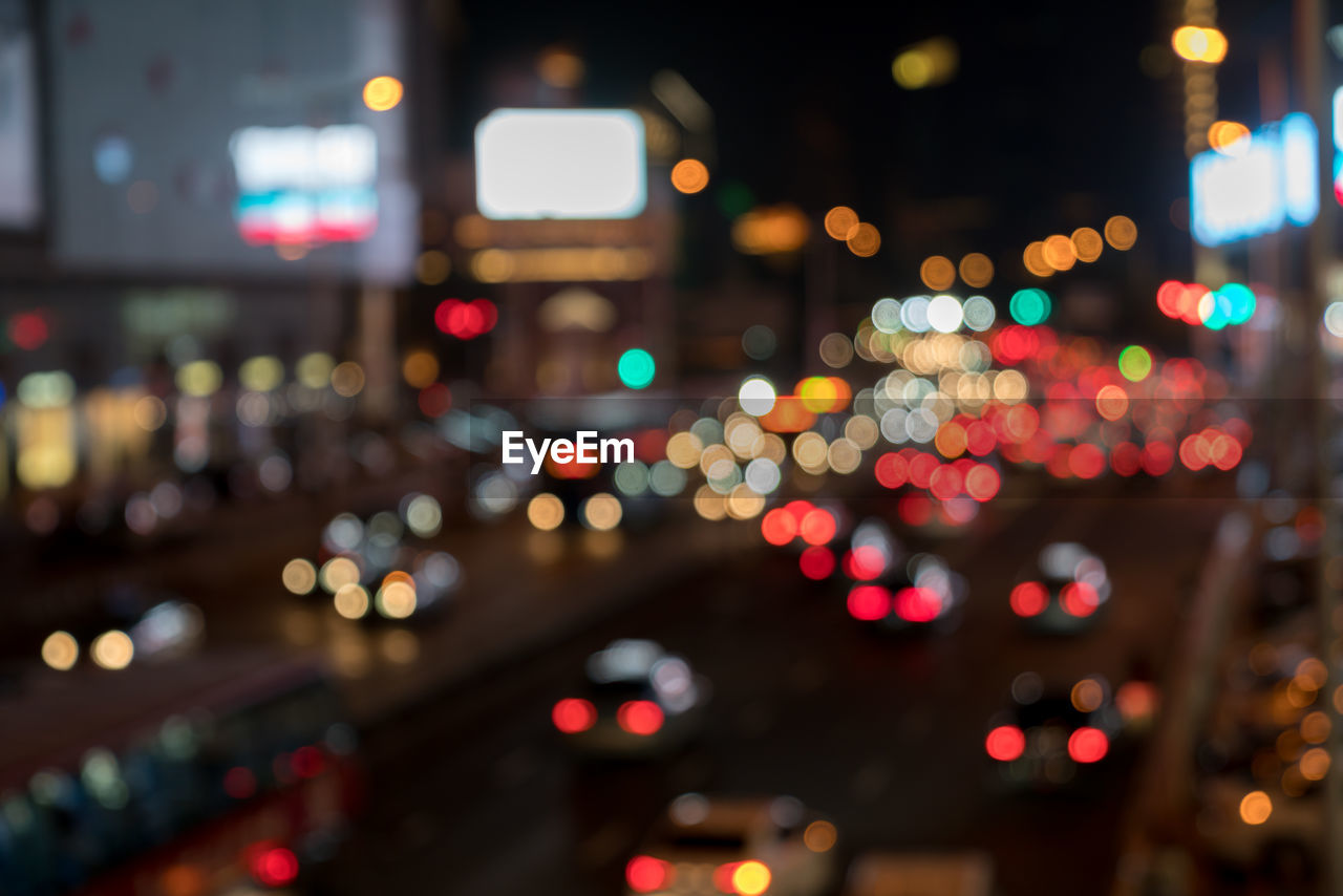 DEFOCUSED IMAGE OF ILLUMINATED CITY