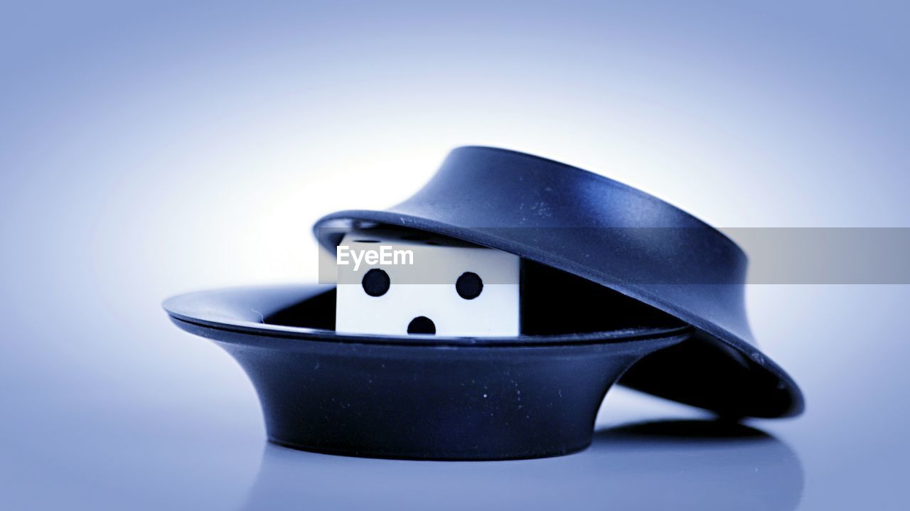 CLOSE-UP VIEW OF BLUE OBJECT OVER WHITE BACKGROUND
