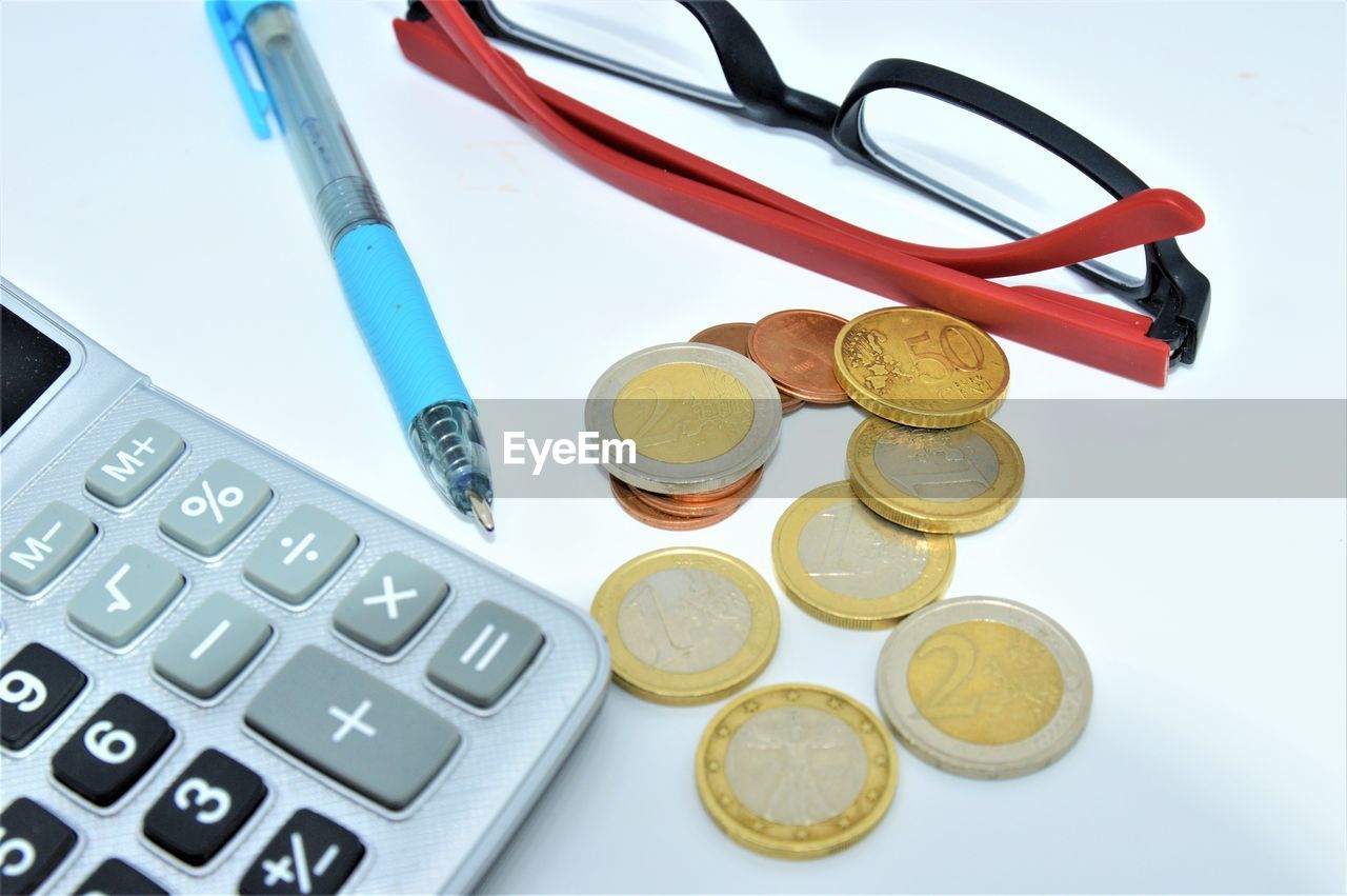 High angle view of coins on table