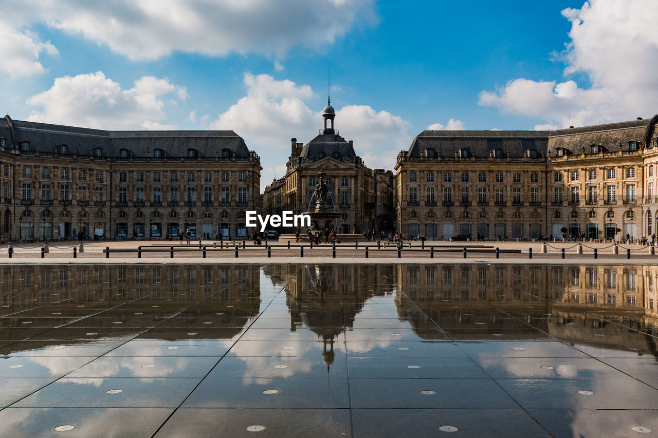 Buildings in city against sky
