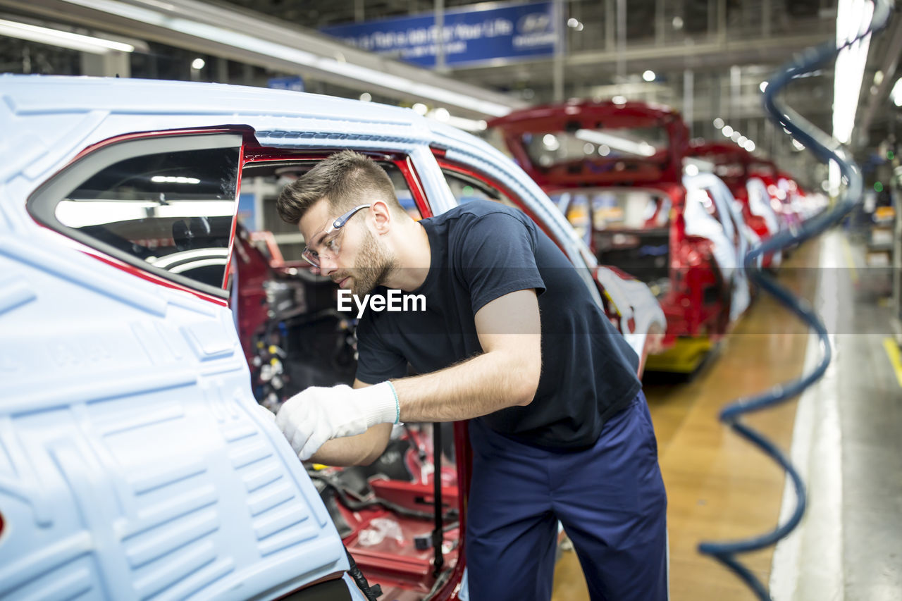 Man working in modern car factory