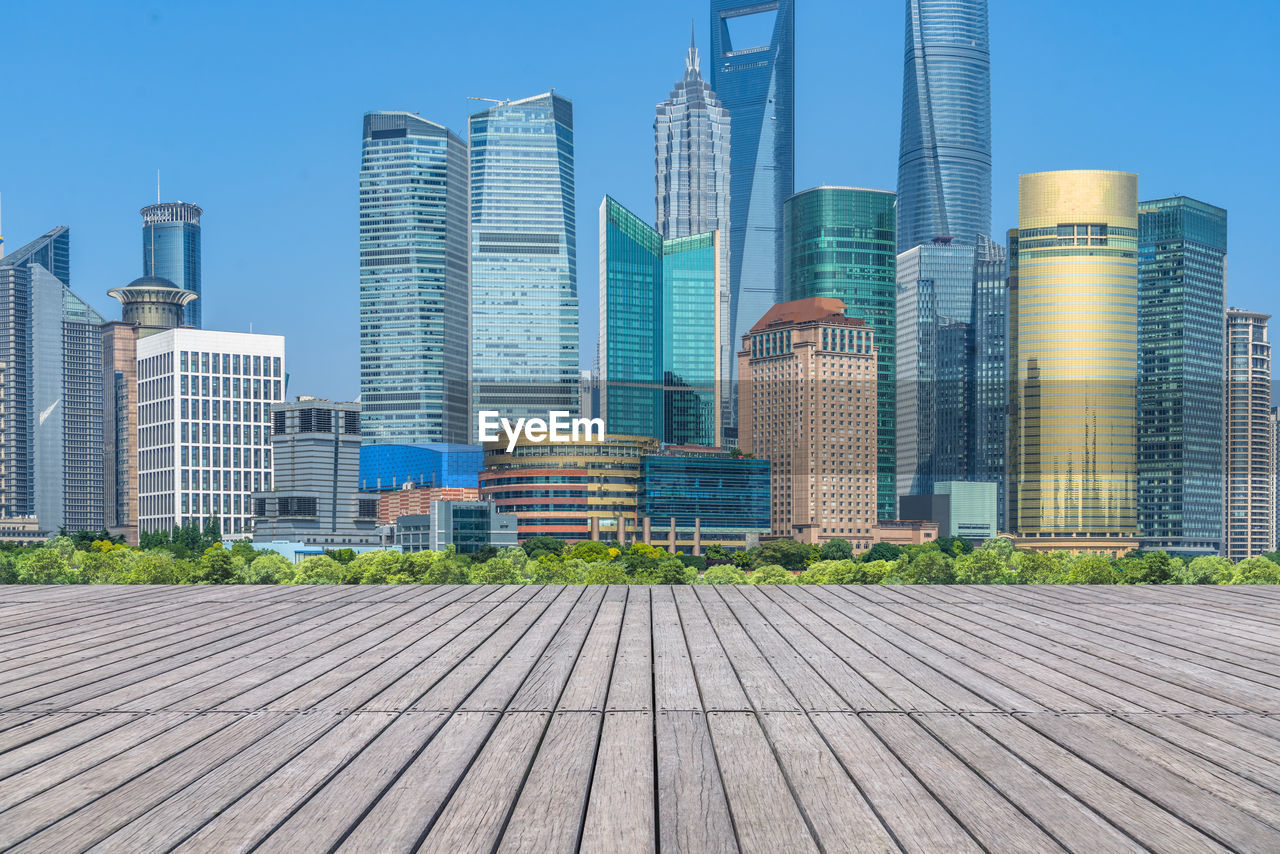 MODERN BUILDINGS AGAINST CLEAR BLUE SKY