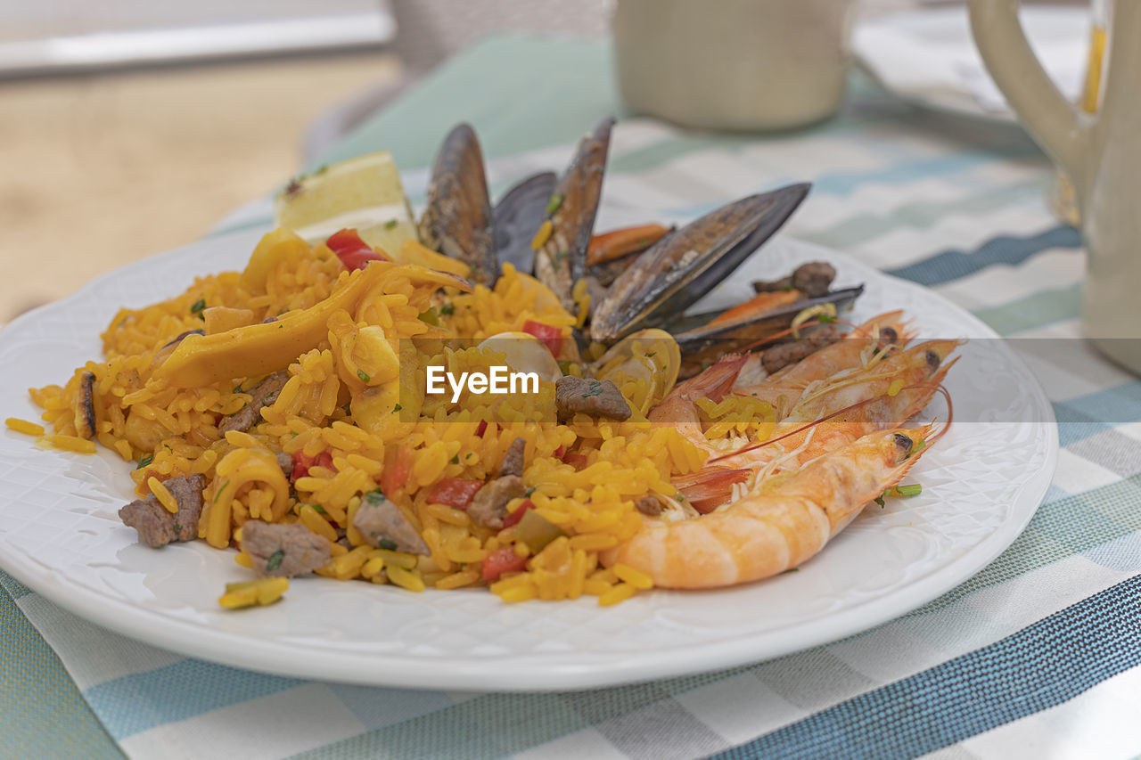 Traditional paella with fish, meat and shellfish.