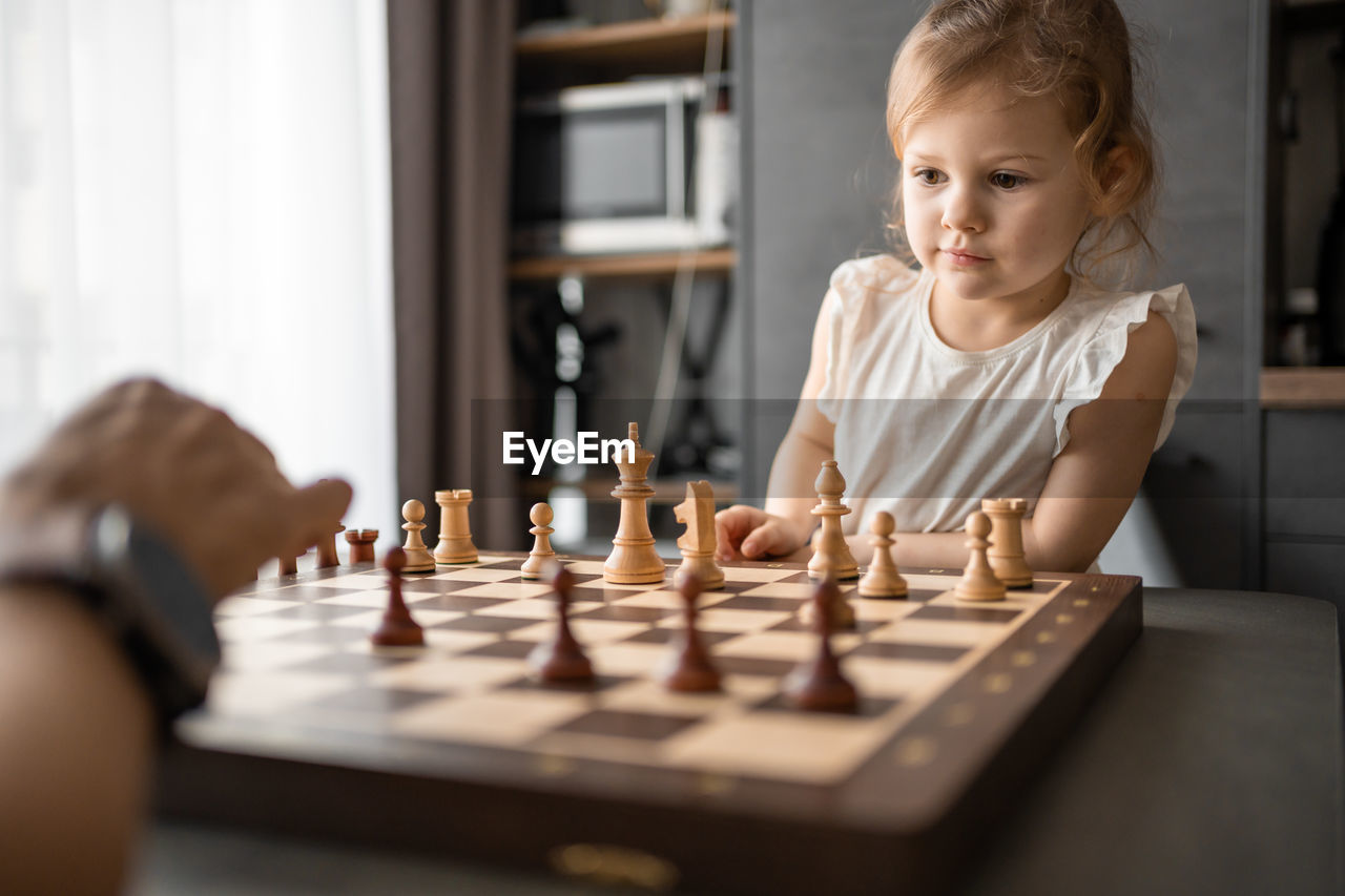 boy playing chess