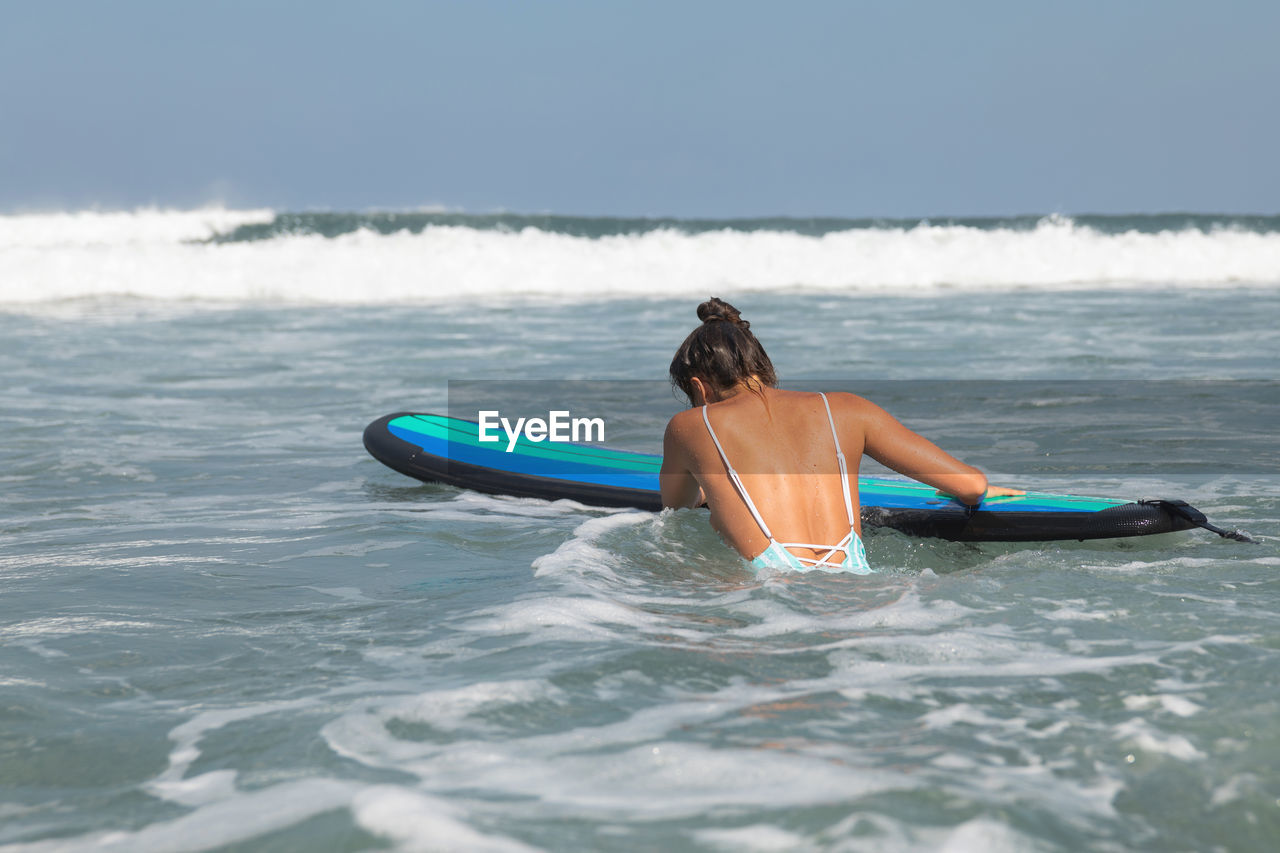 high angle view of man swimming in sea