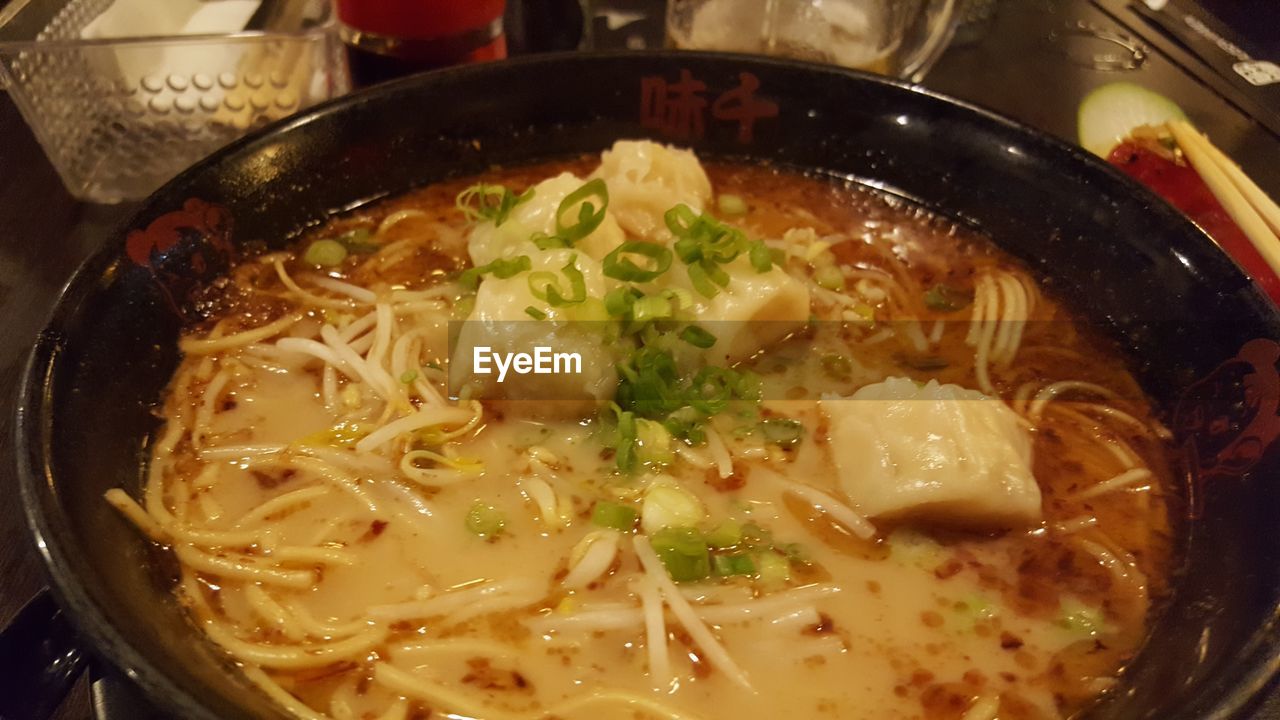 CLOSE-UP OF SOUP SERVED WITH NOODLES