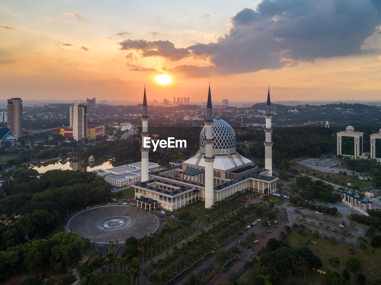 AERIAL VIEW OF CITY BUILDINGS AT SUNSET