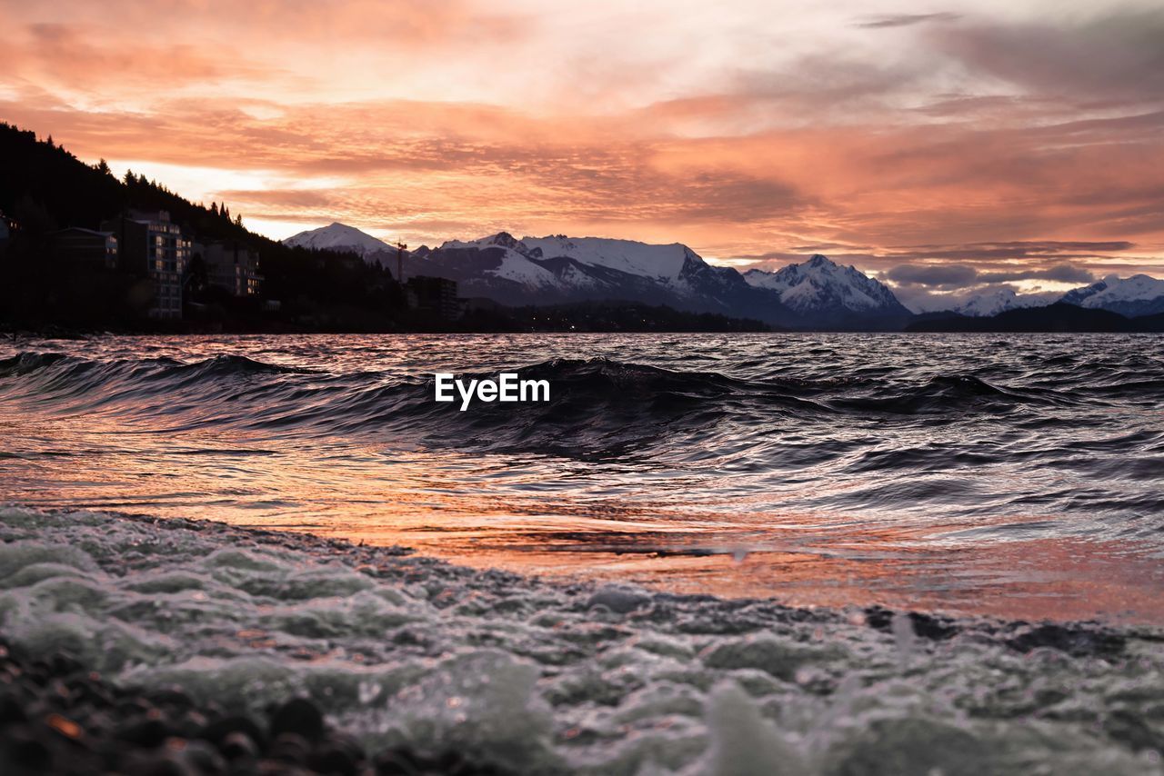 SCENIC VIEW OF BEACH DURING SUNSET