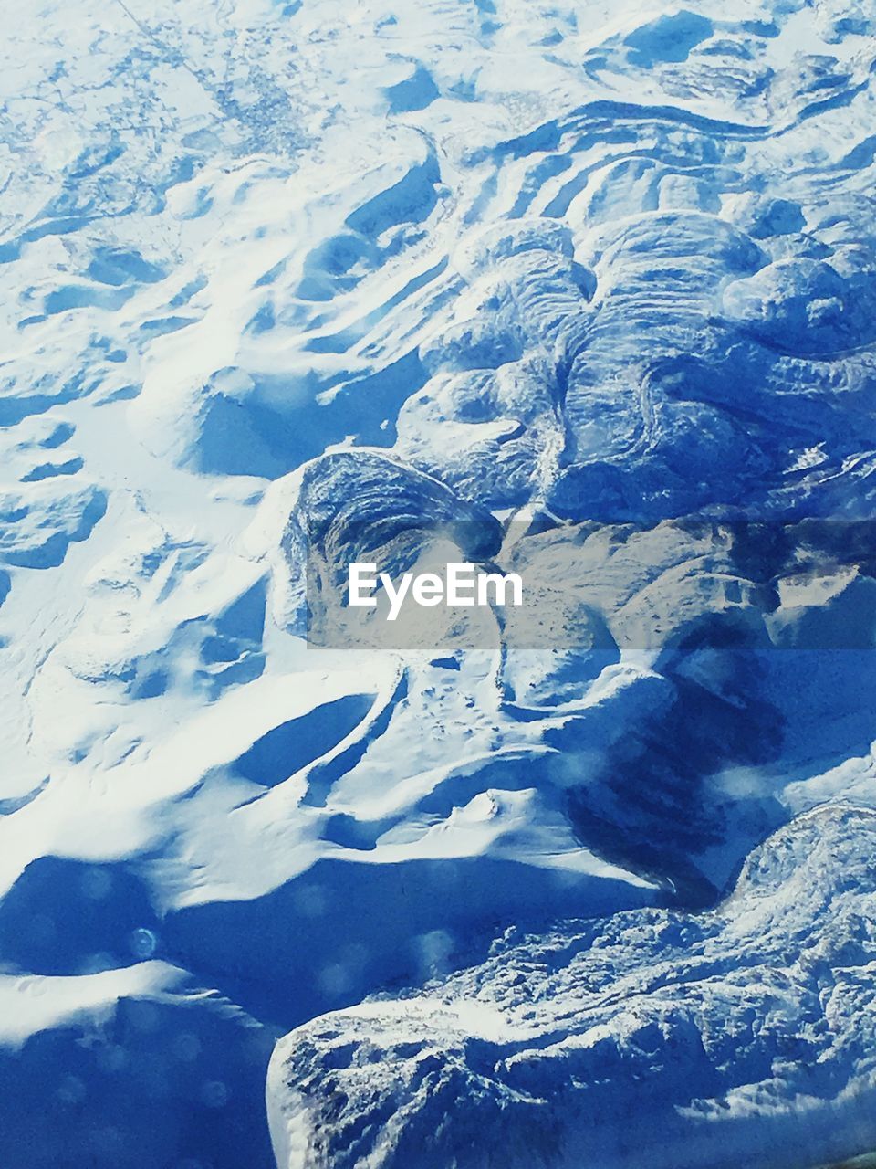 HIGH ANGLE VIEW OF LANDSCAPE WITH MOUNTAIN IN BACKGROUND