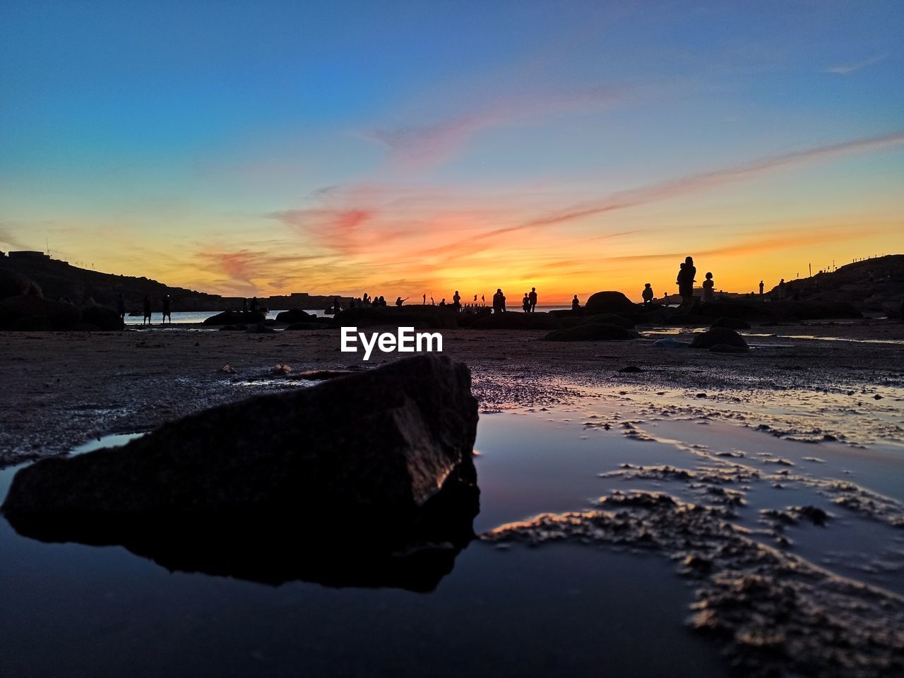 scenic view of sea against clear sky during sunset