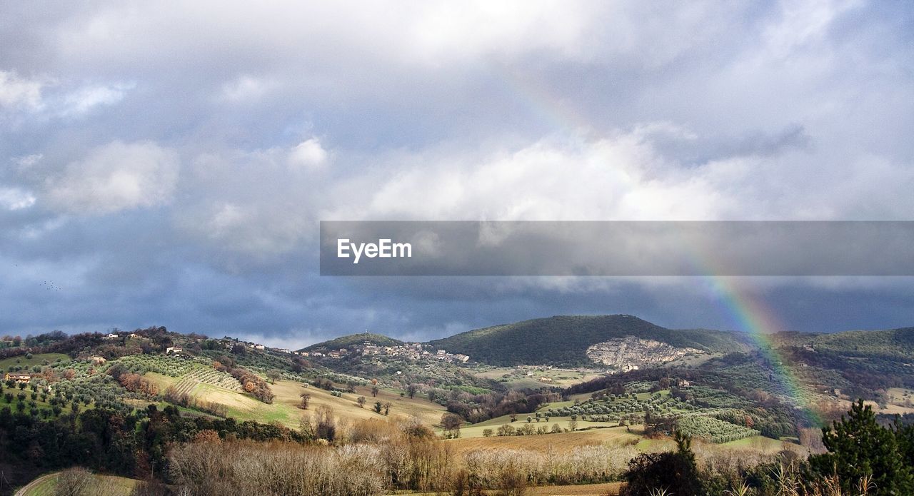 SCENIC VIEW OF RAINBOW OVER LANDSCAPE