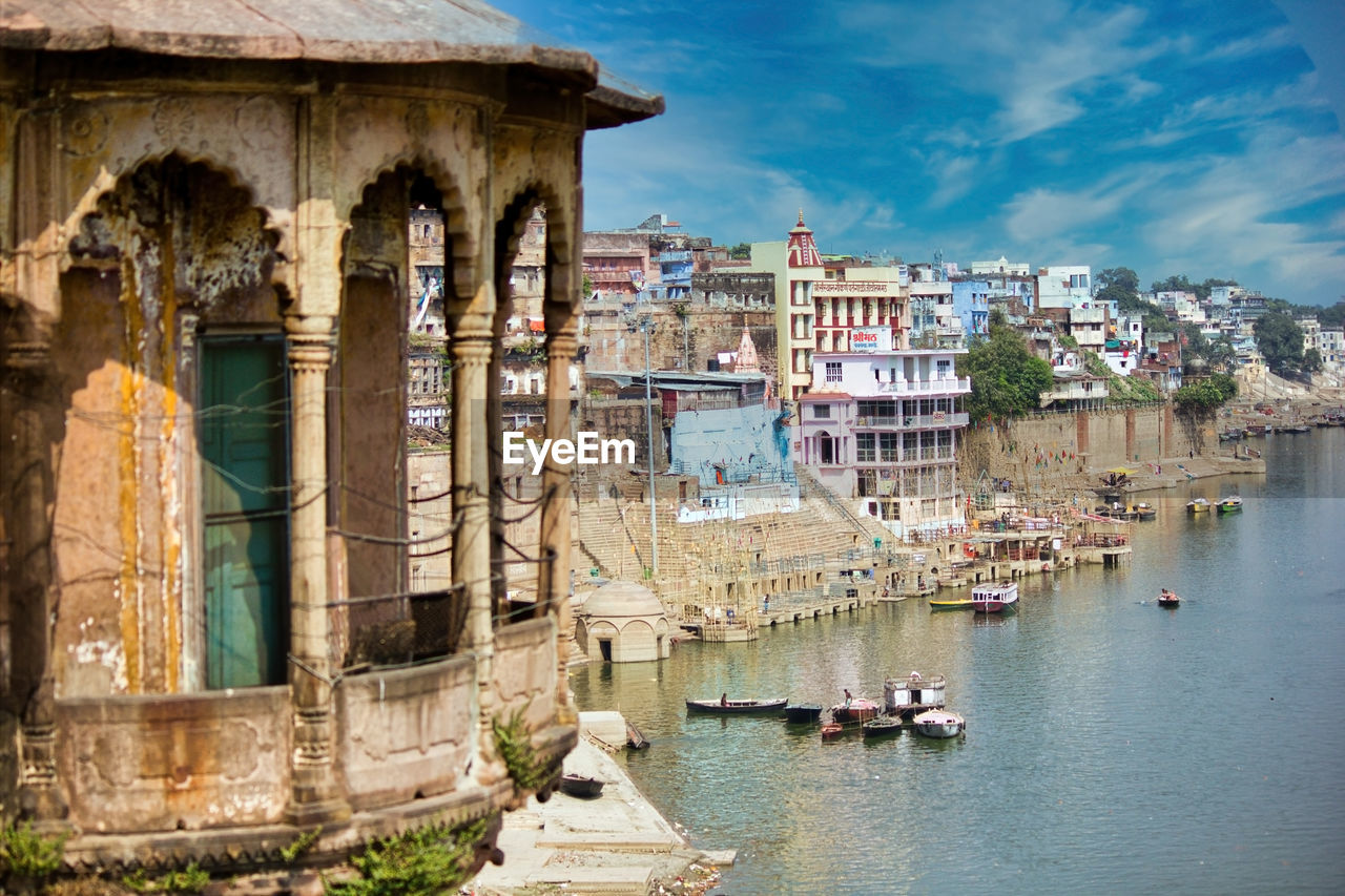 Wide angle top view of banaras cityscape ghat next to ganges river and an indian style dome balcony