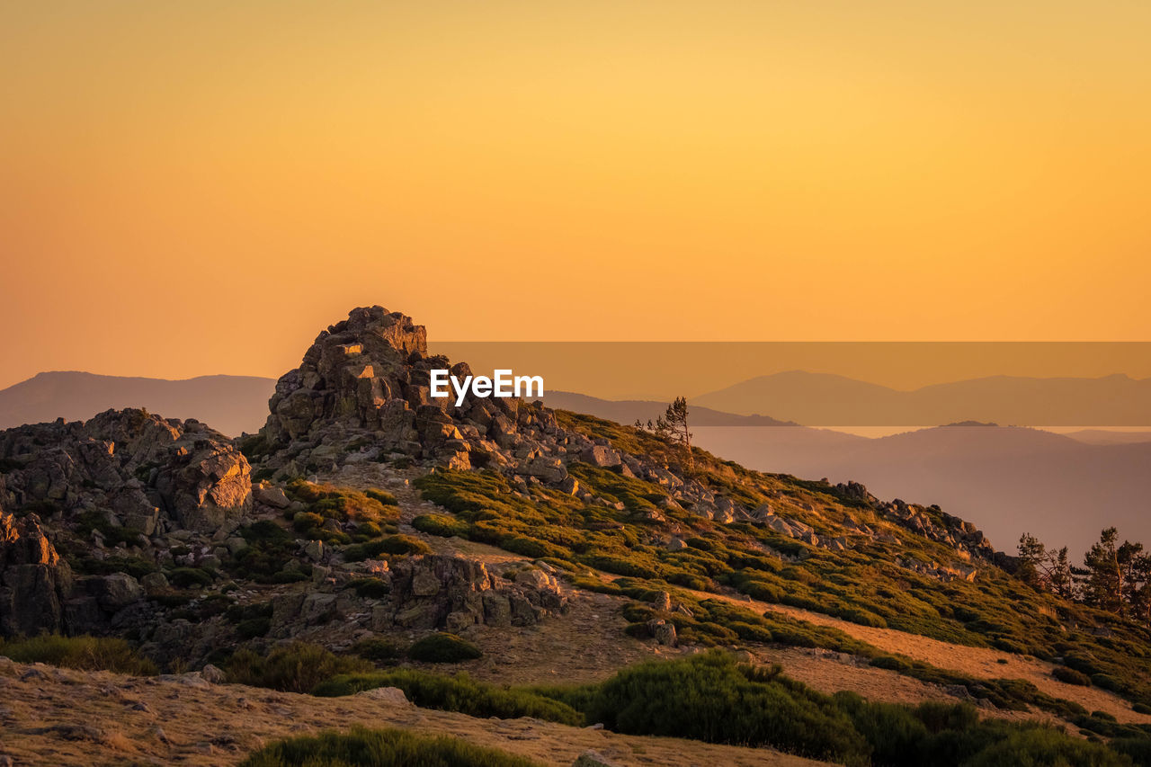 Scenic view of mountains against sky during sunset