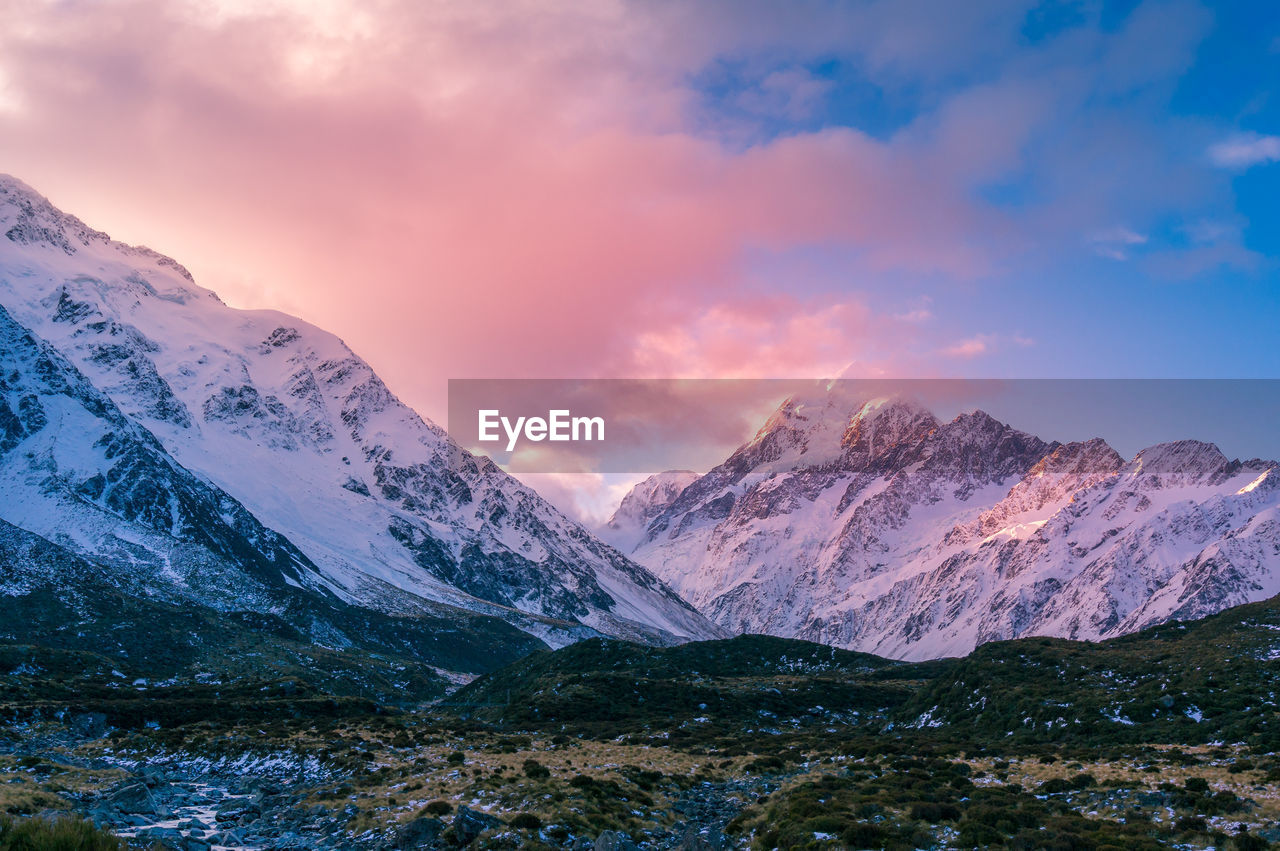 Winter mountain landscape with colorful clouds at sunset. snow covered mountains nature landscape