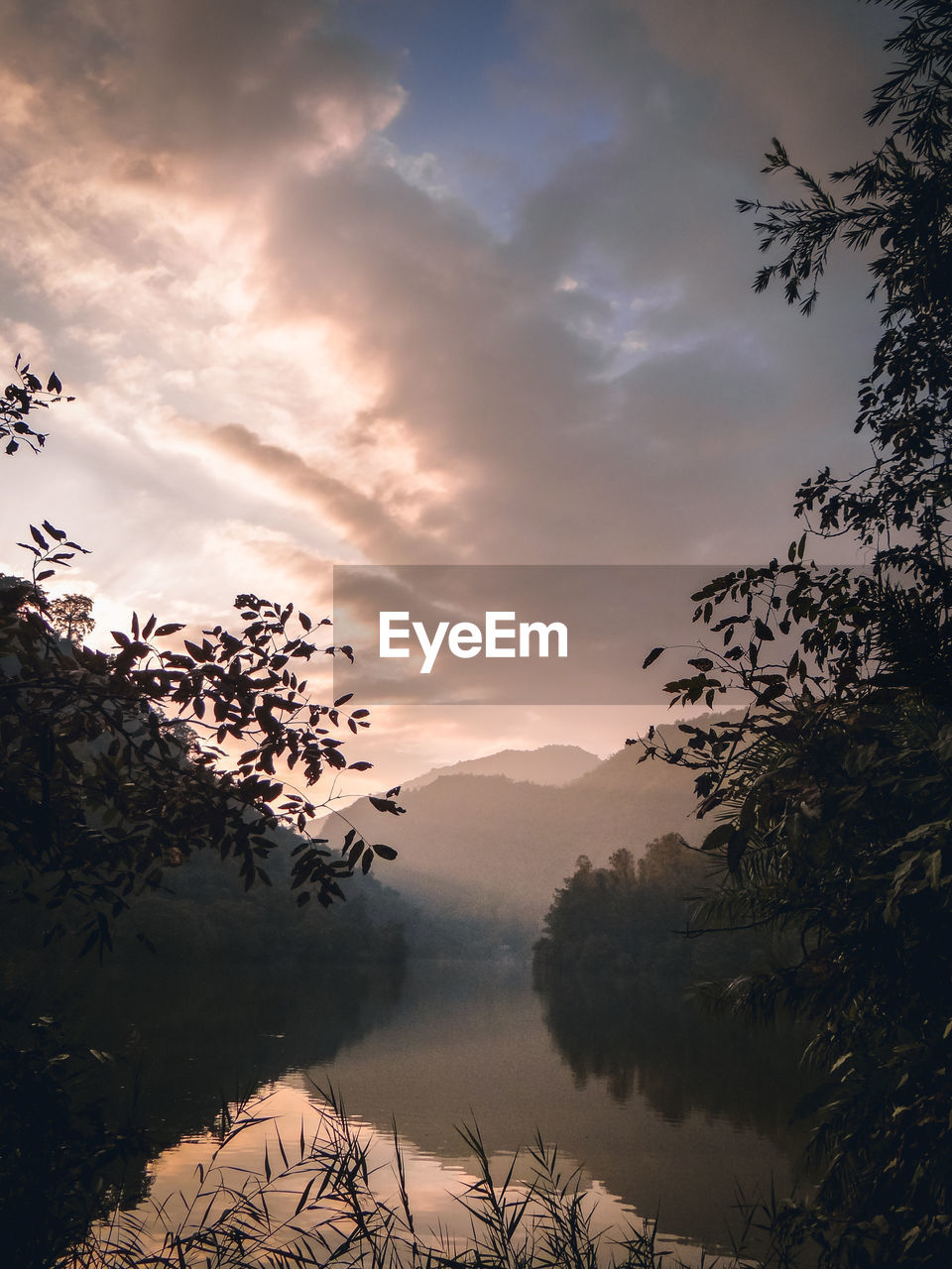 Scenic view of lake against sky during sunset