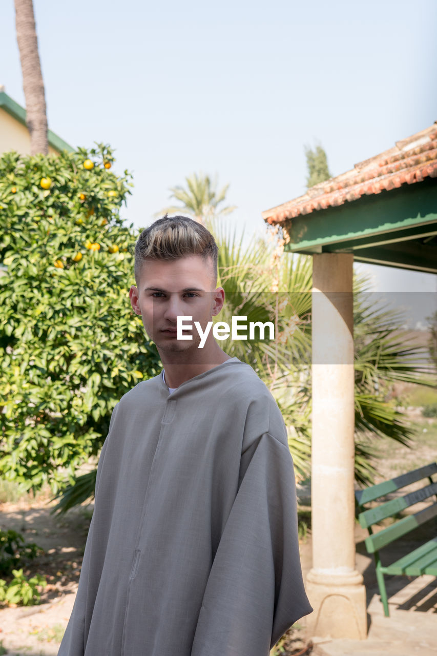 Young man in the monastery garden