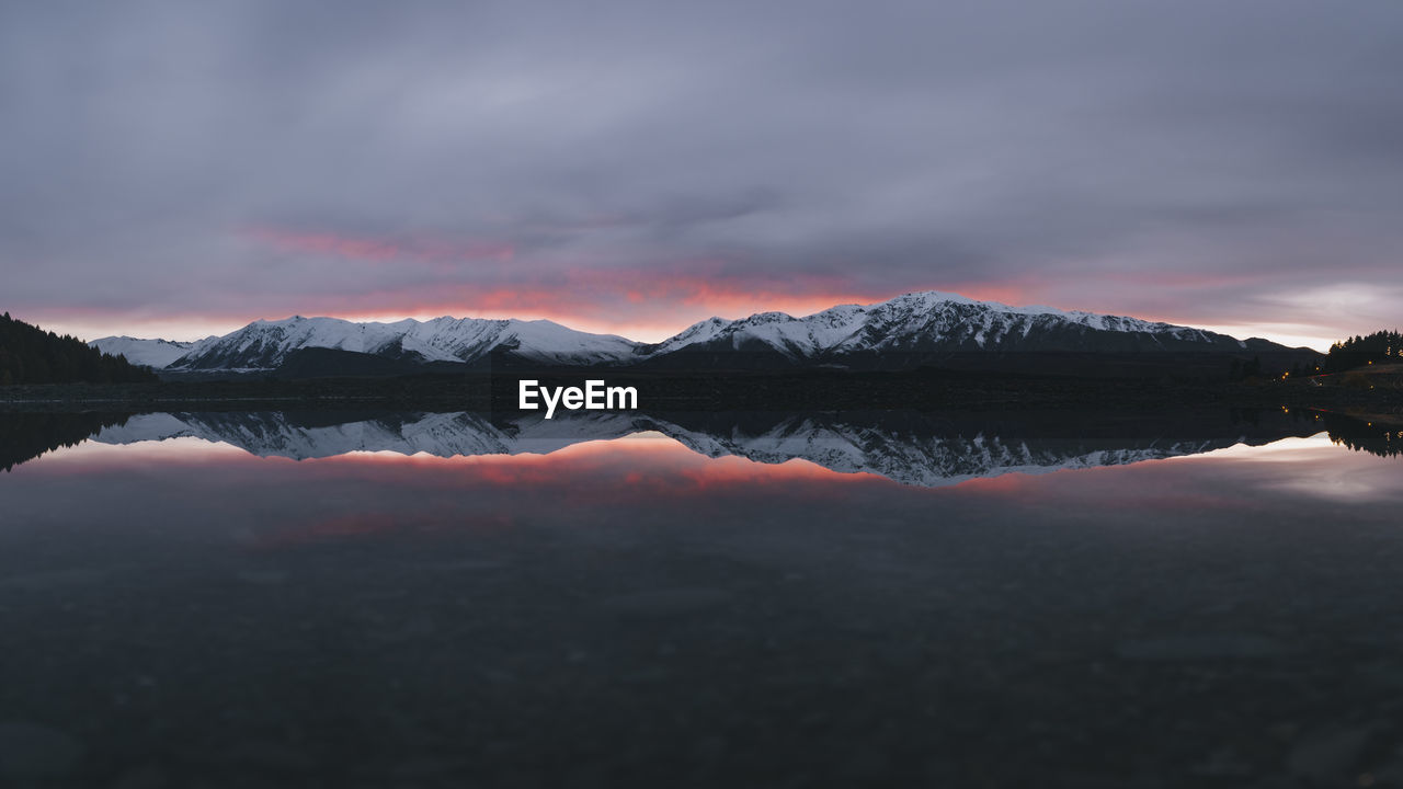 Unbelievable sunrise at lake tekapo, southern alps, new zealand