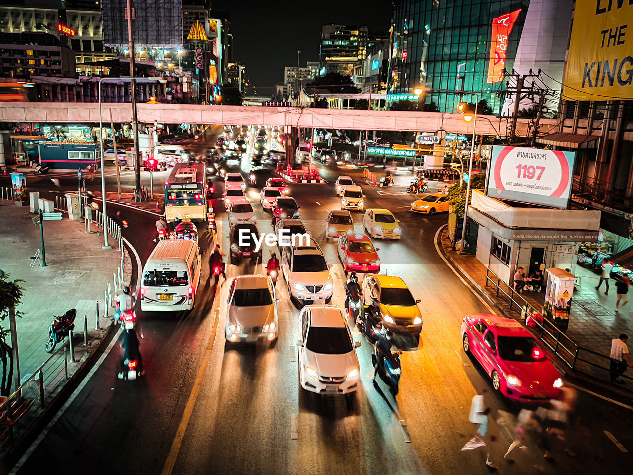 HIGH ANGLE VIEW OF CARS ON CITY STREET AT NIGHT