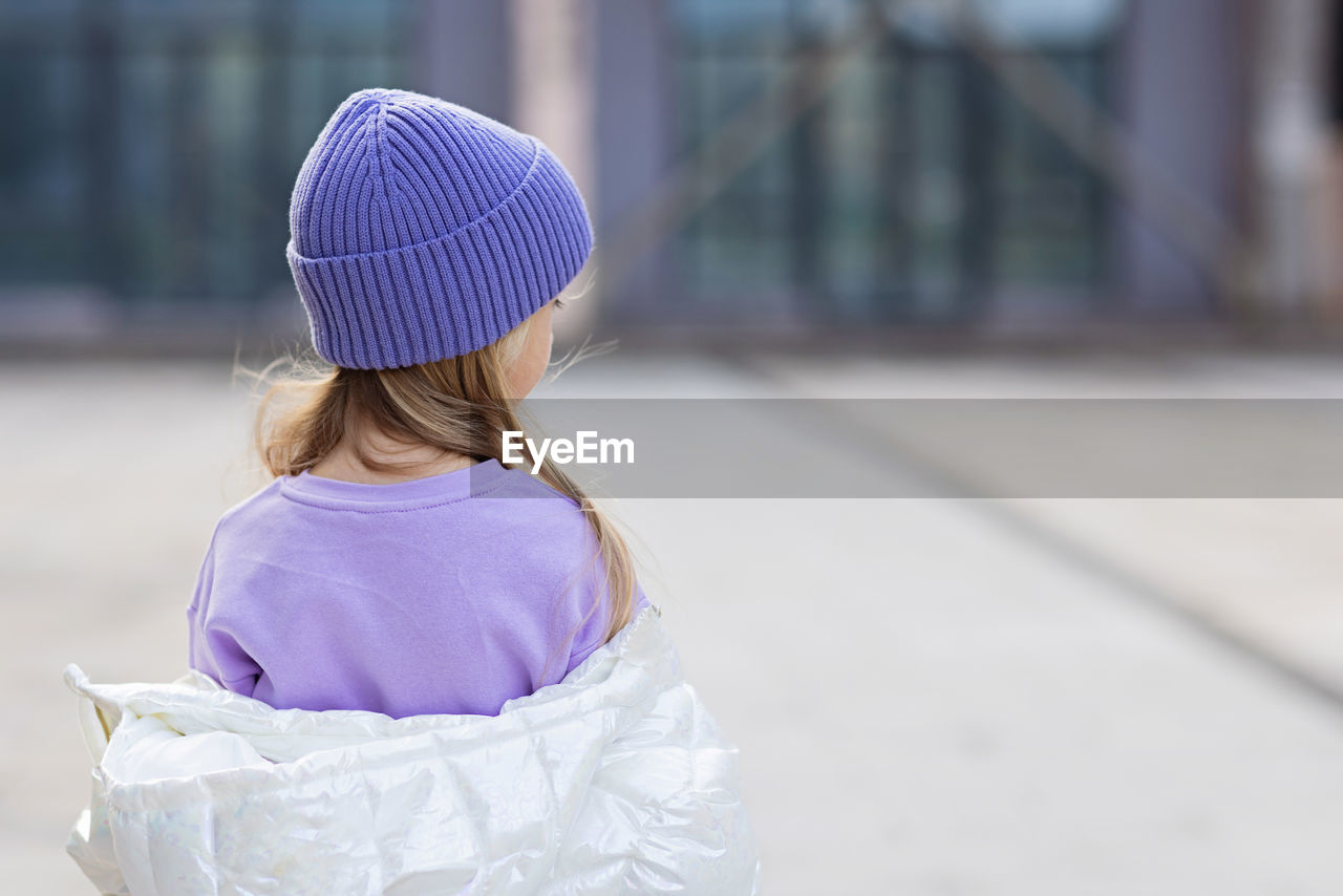 Rear view of girl wearing hat