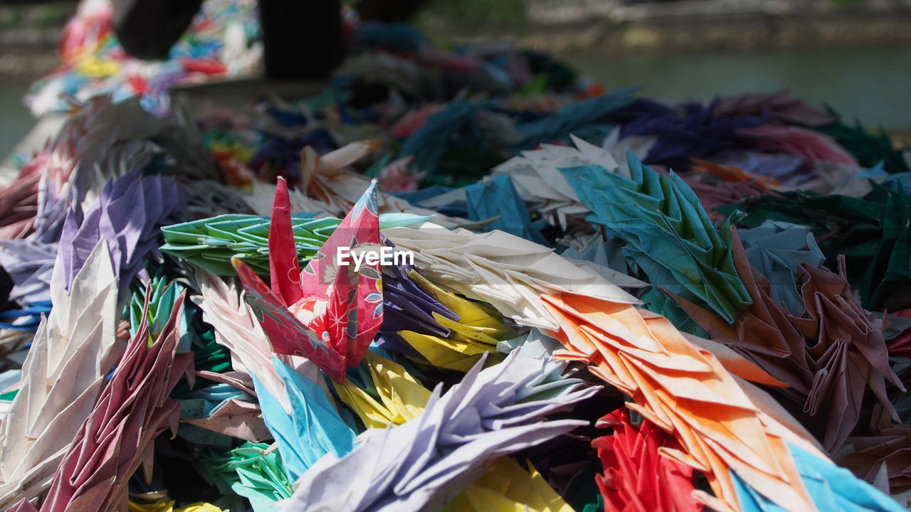 Multi colored papers crafts on sunny day