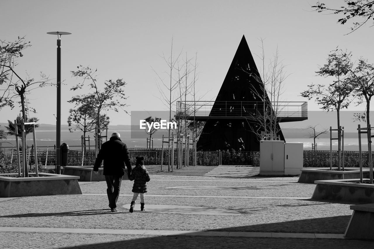 WOMAN WALKING ON ROAD