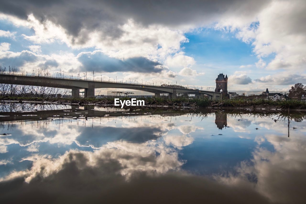 VIEW OF BRIDGE OVER RIVER AGAINST SKY