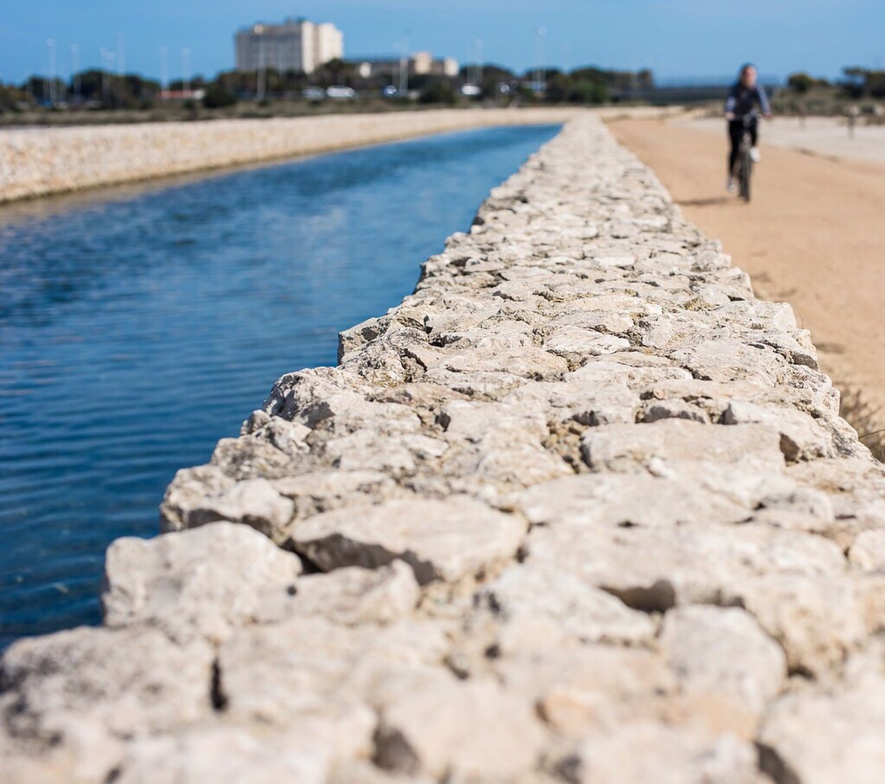 SURFACE LEVEL OF WOMAN STANDING ON SHORE