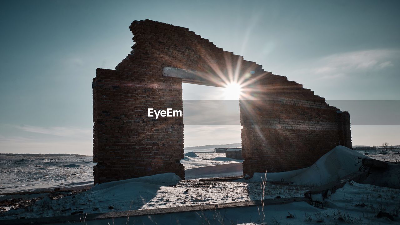 SUN SHINING THROUGH OLD RUIN