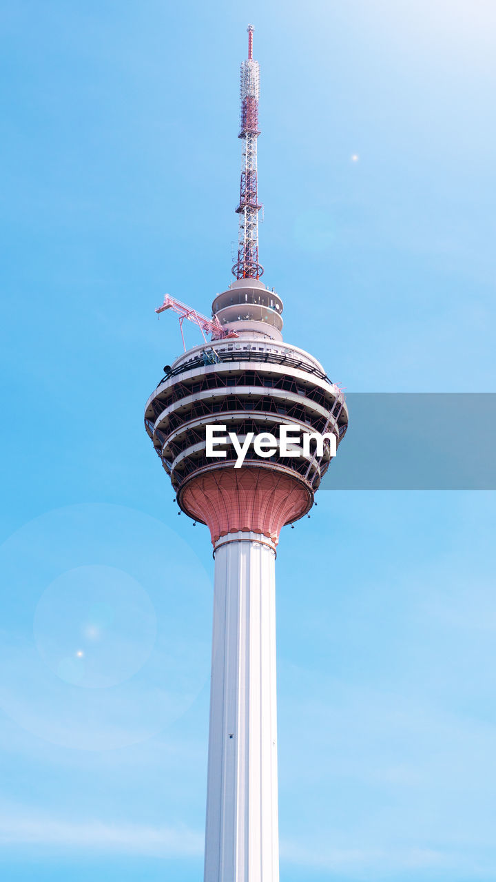 Low angle view of kl tower against clear blue sky