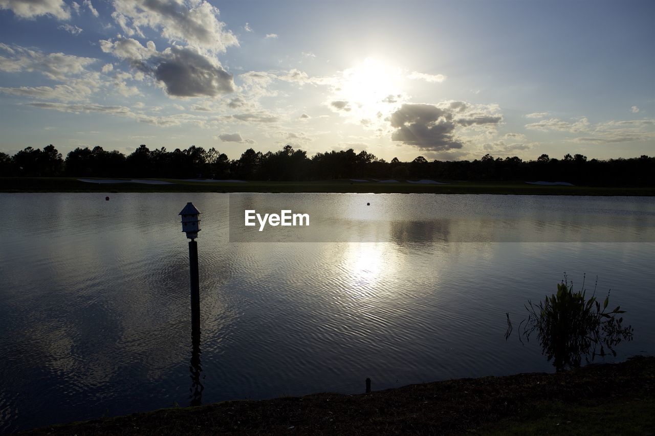 SCENIC VIEW OF LAKE BY SILHOUETTE TREES AGAINST SKY