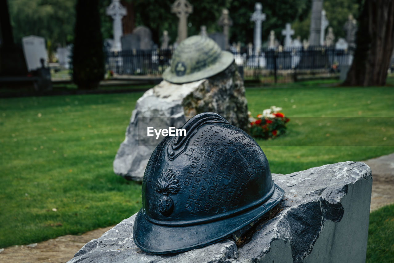 Closeup on irish infantry helmet, a memorial of fallen soldiers who fought in ww, glasnevin cemetery