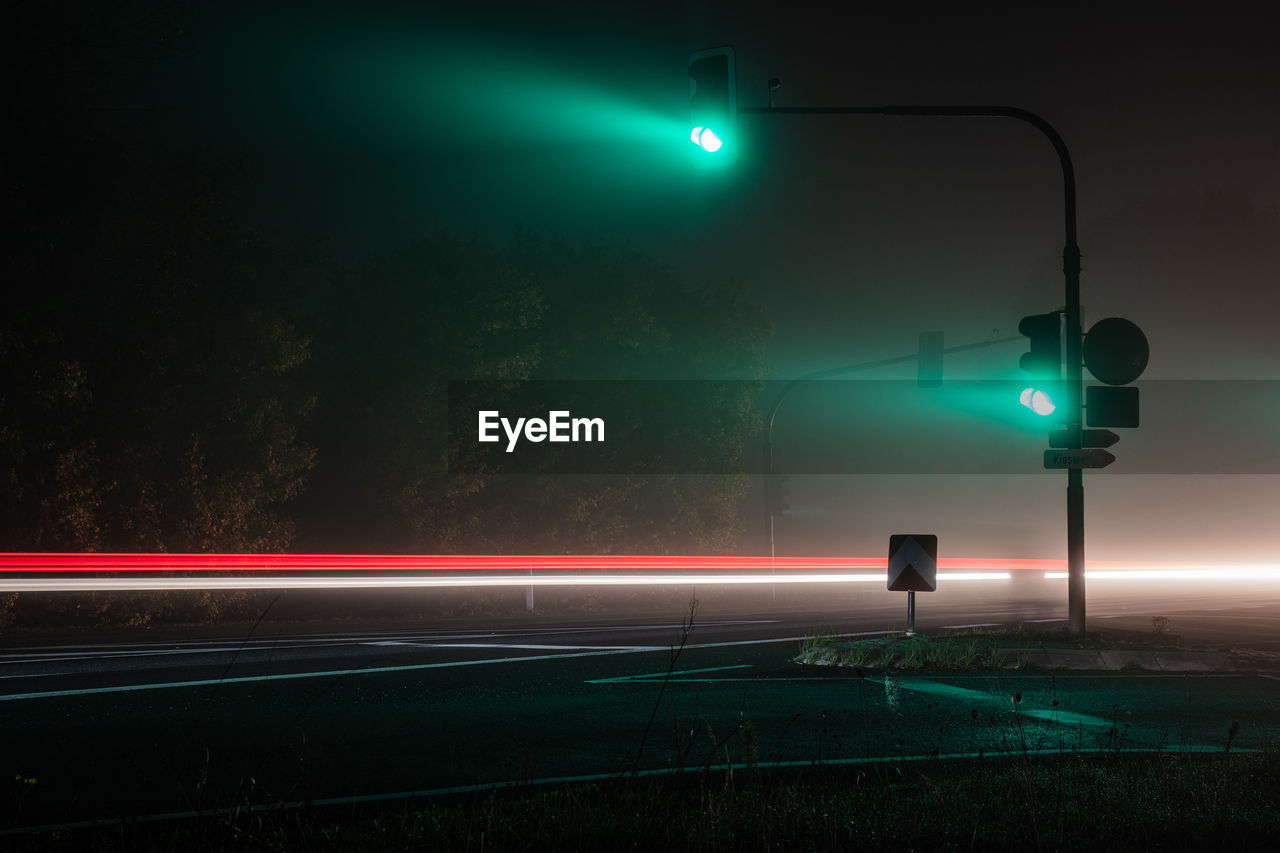 high angle view of light trails on road at night