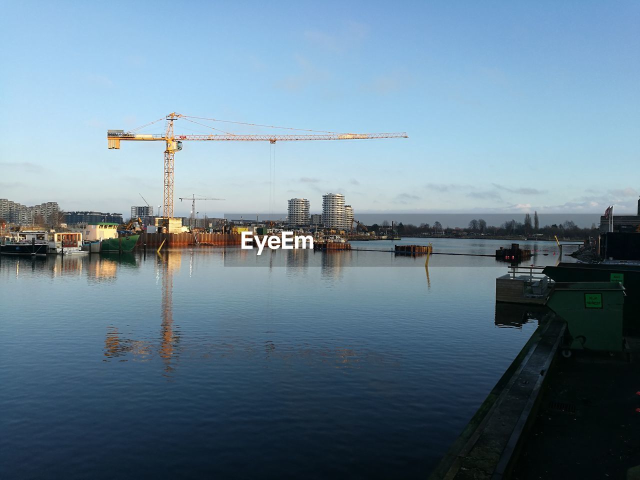 CRANES AT CONSTRUCTION SITE IN CITY