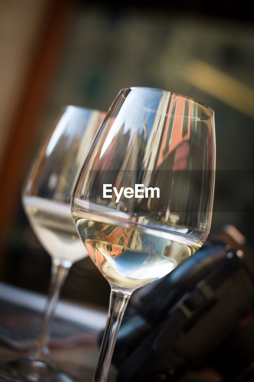 CLOSE-UP OF BEER GLASSES ON TABLE