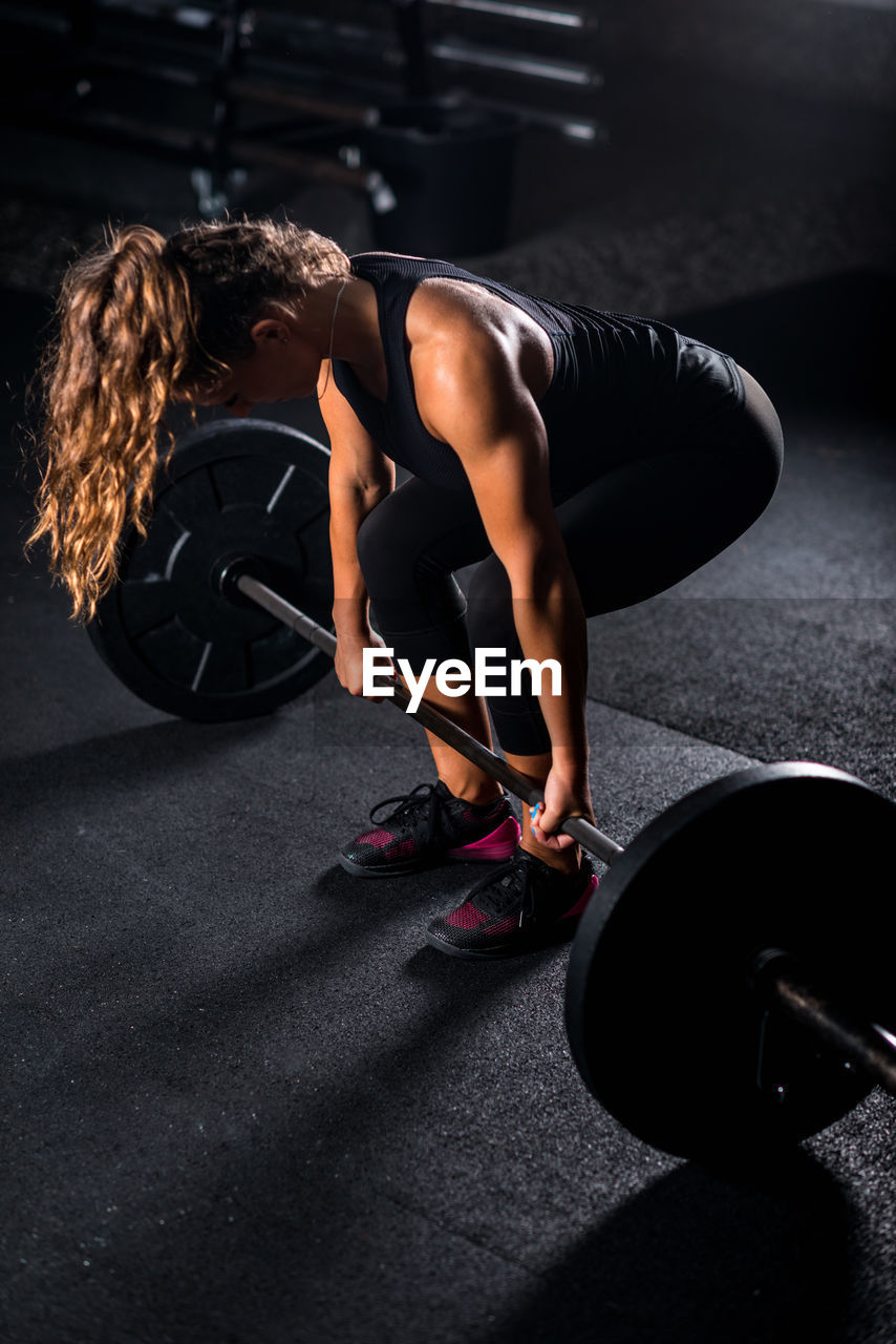 Athlete weightlifting in gym