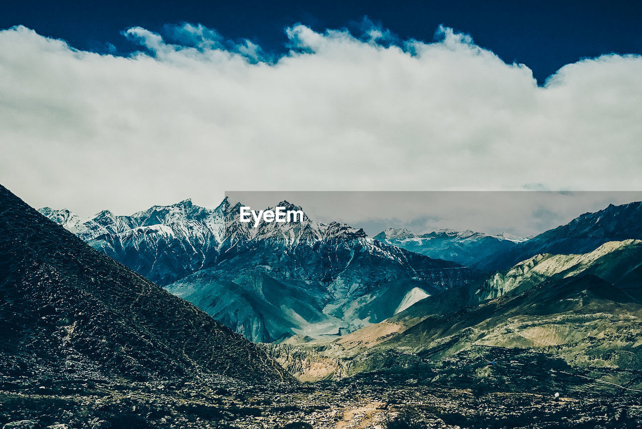 Scenic view of snowcapped mountains against sky