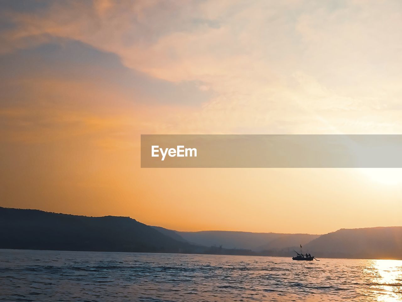 SCENIC VIEW OF SEA DURING SUNSET