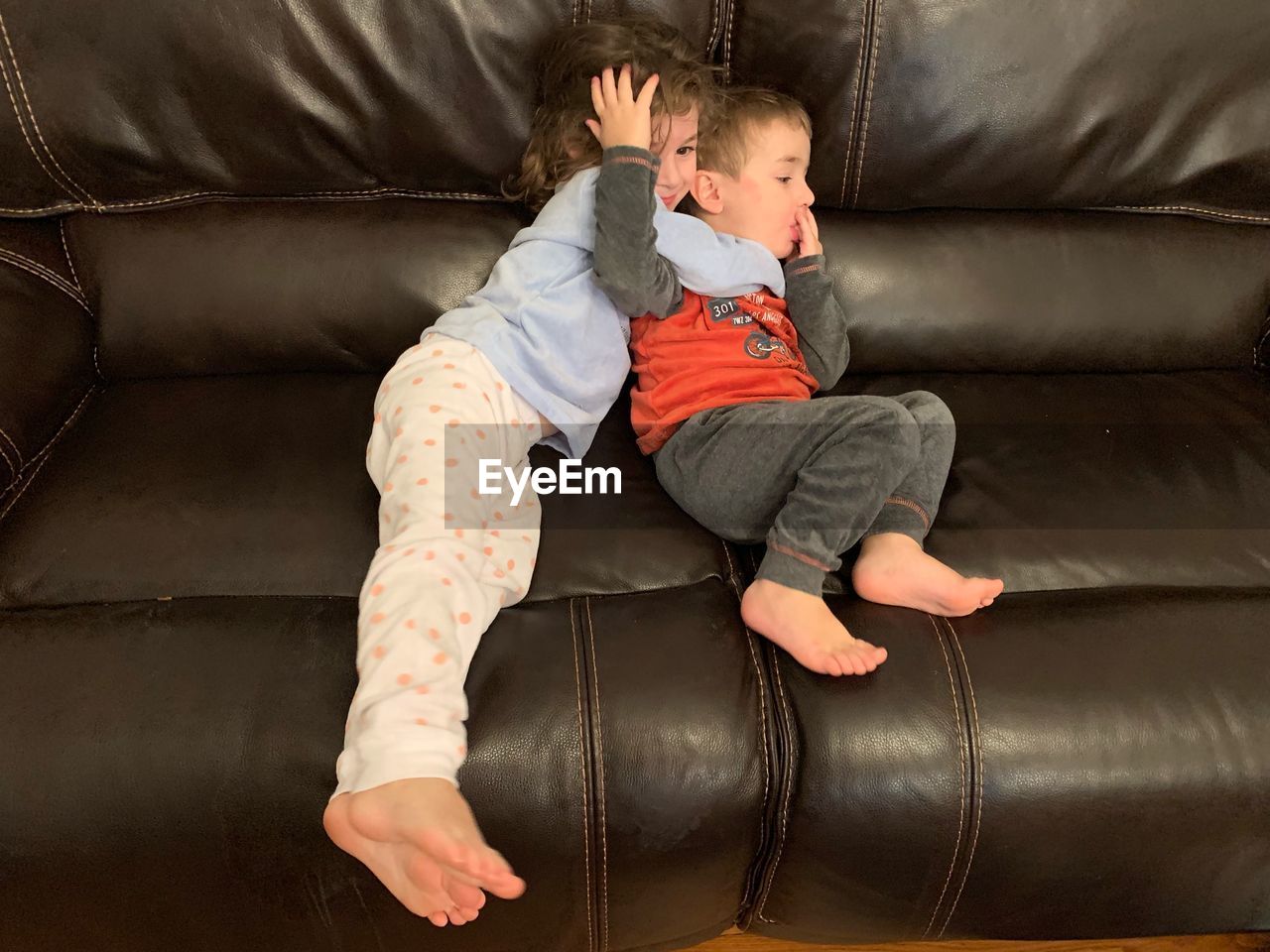 HIGH ANGLE VIEW OF BOY SLEEPING IN SOFA