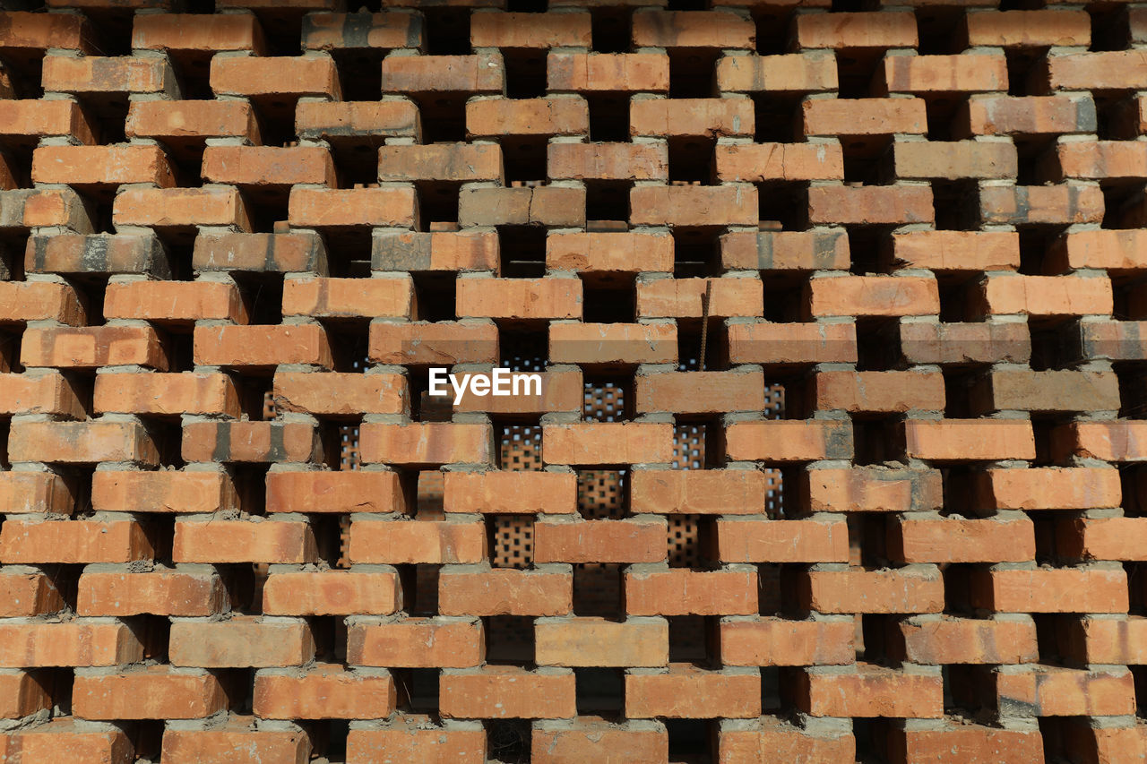 pattern, backgrounds, full frame, floor, flooring, brick, art, no people, brown, repetition, brickwork, circle, wall, textured, tile, shape, large group of objects, indoors, abundance, road surface, line