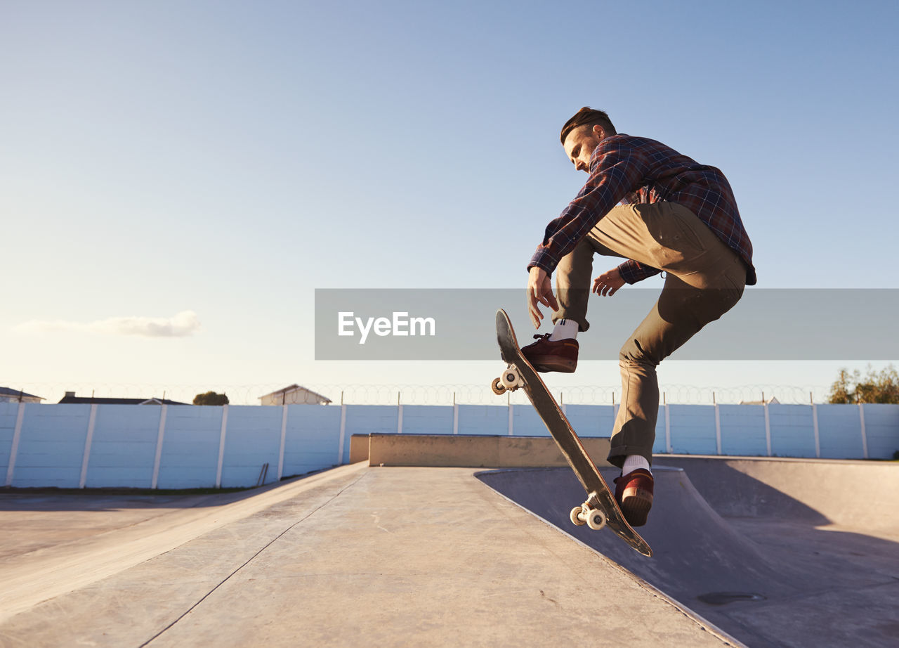 Man skateboarding in skateboard park