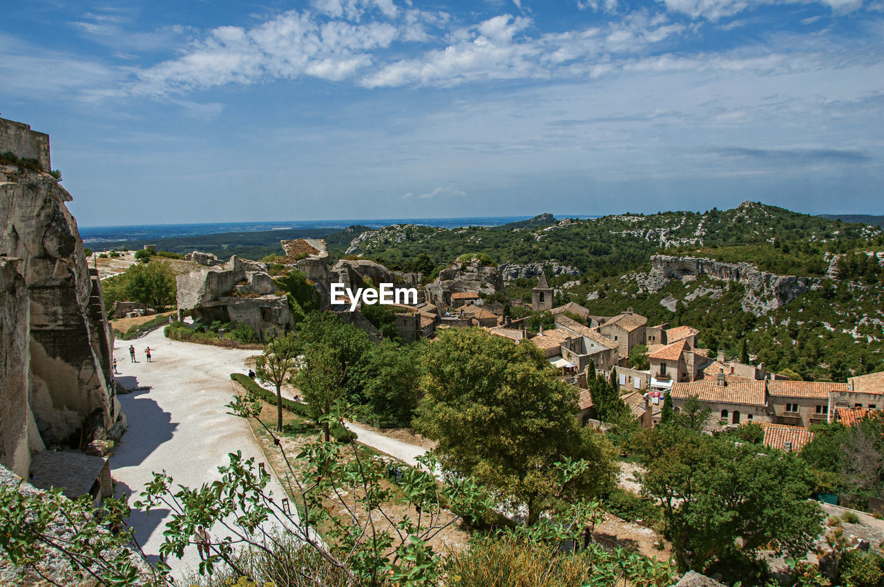 View of the baux-de-provence castle ruins on the hill, with the roofs of the village, france.