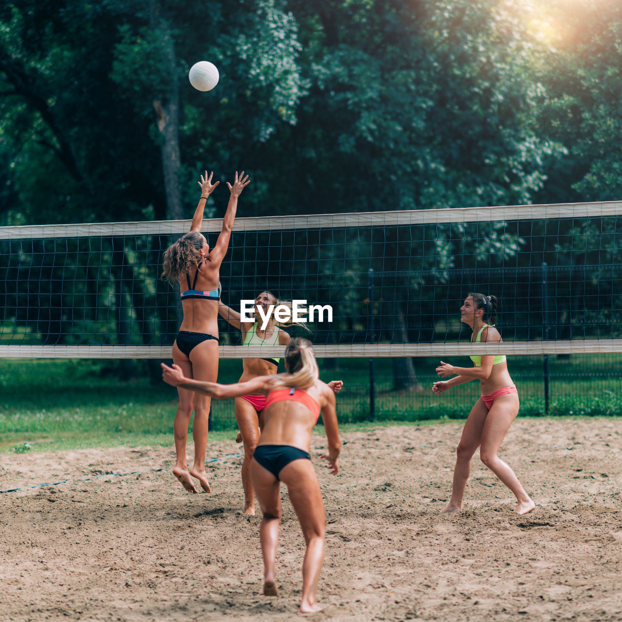 Female team playing beach volleyball