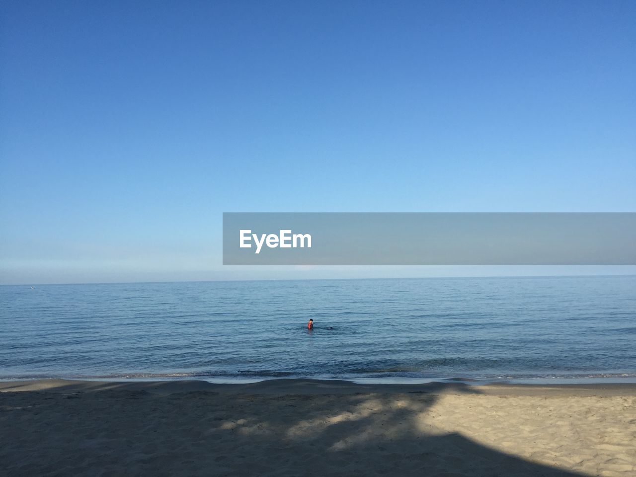 SCENIC VIEW OF BEACH AGAINST CLEAR SKY