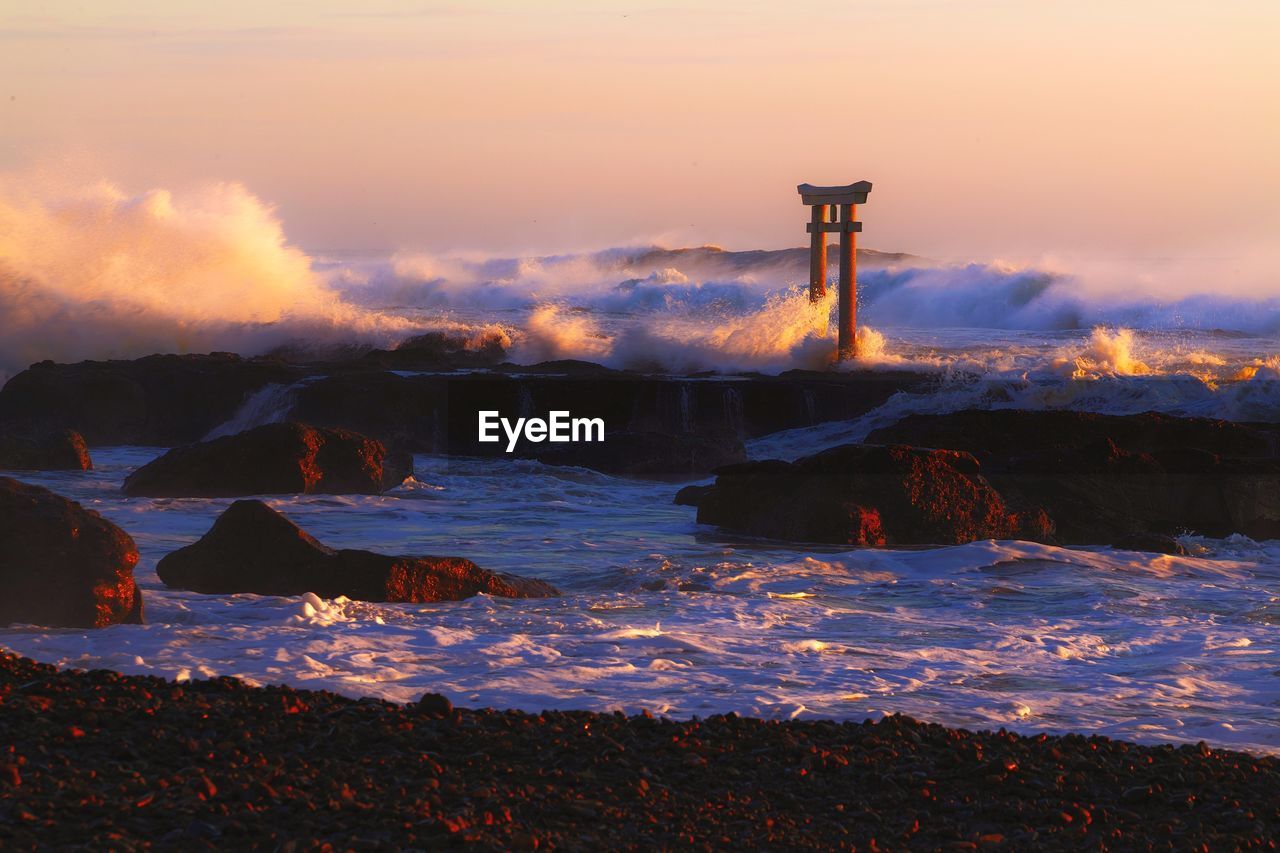 Scenic view of sea against sky during sunset