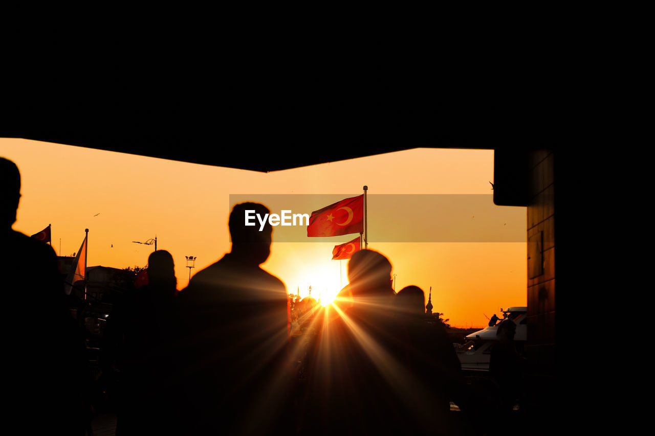 low angle view of silhouette woman standing against clear sky during sunset