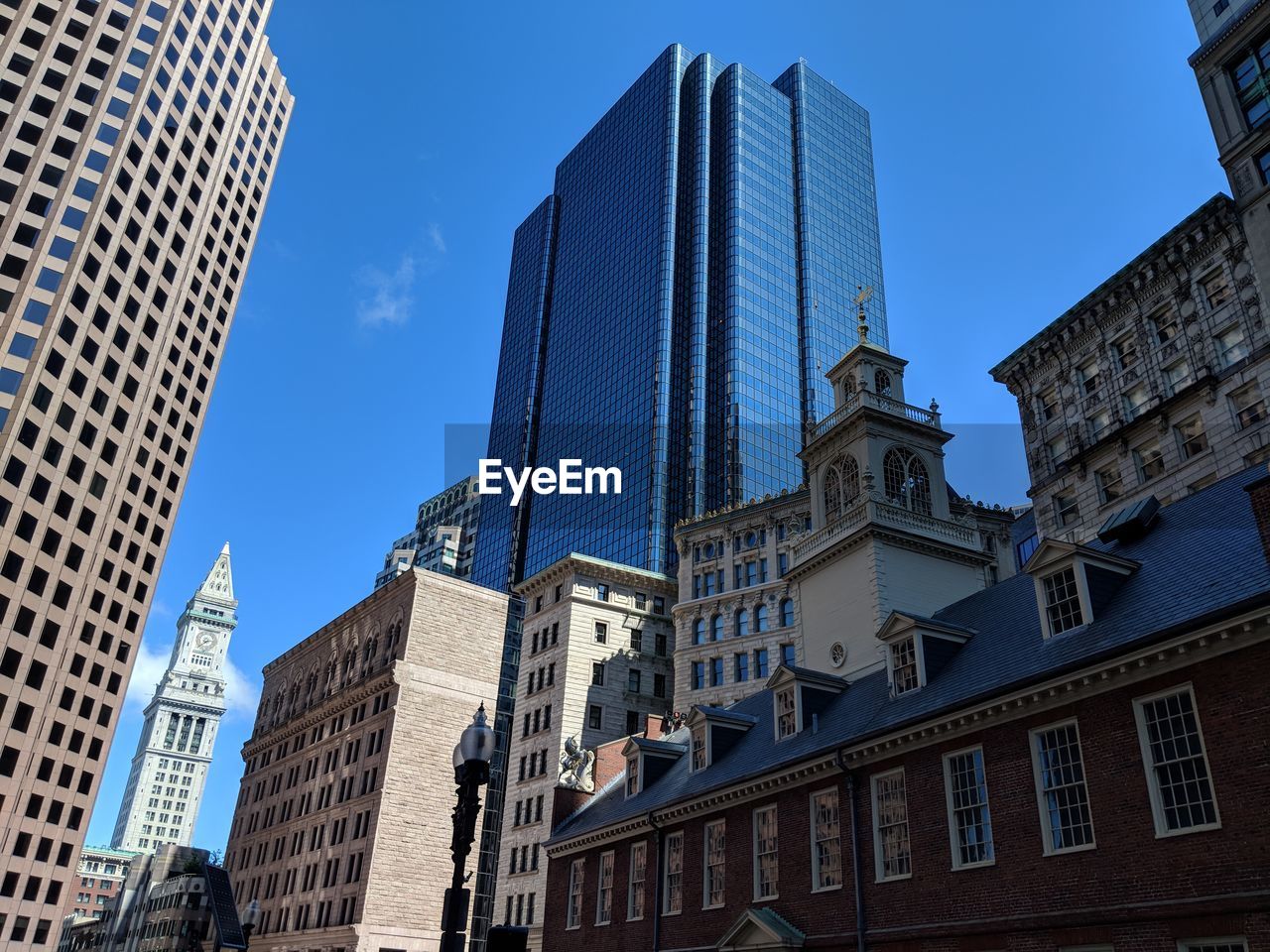 Low angle view of buildings against blue sky