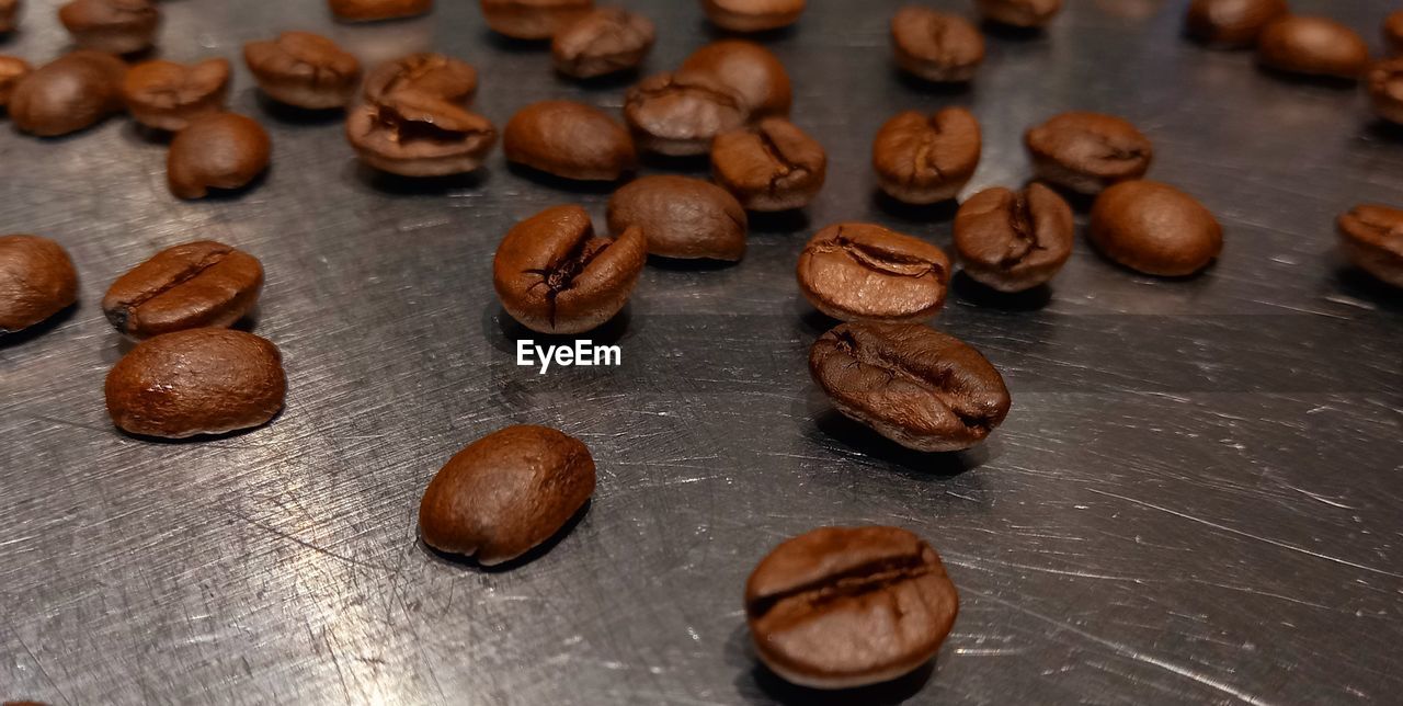 food and drink, food, coffee, freshness, brown, indoors, produce, close-up, still life, large group of objects, no people, roasted coffee bean, table, nut - food, drink, nut, wellbeing, high angle view