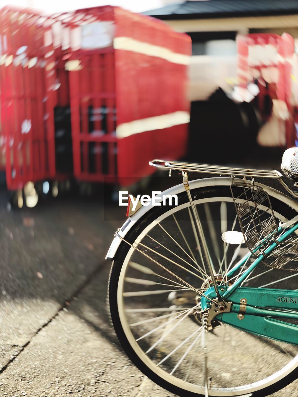 CLOSE-UP OF BICYCLE WHEEL AGAINST RED FIRE