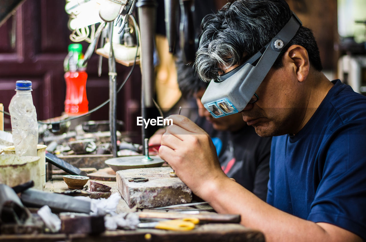 Man working on metal